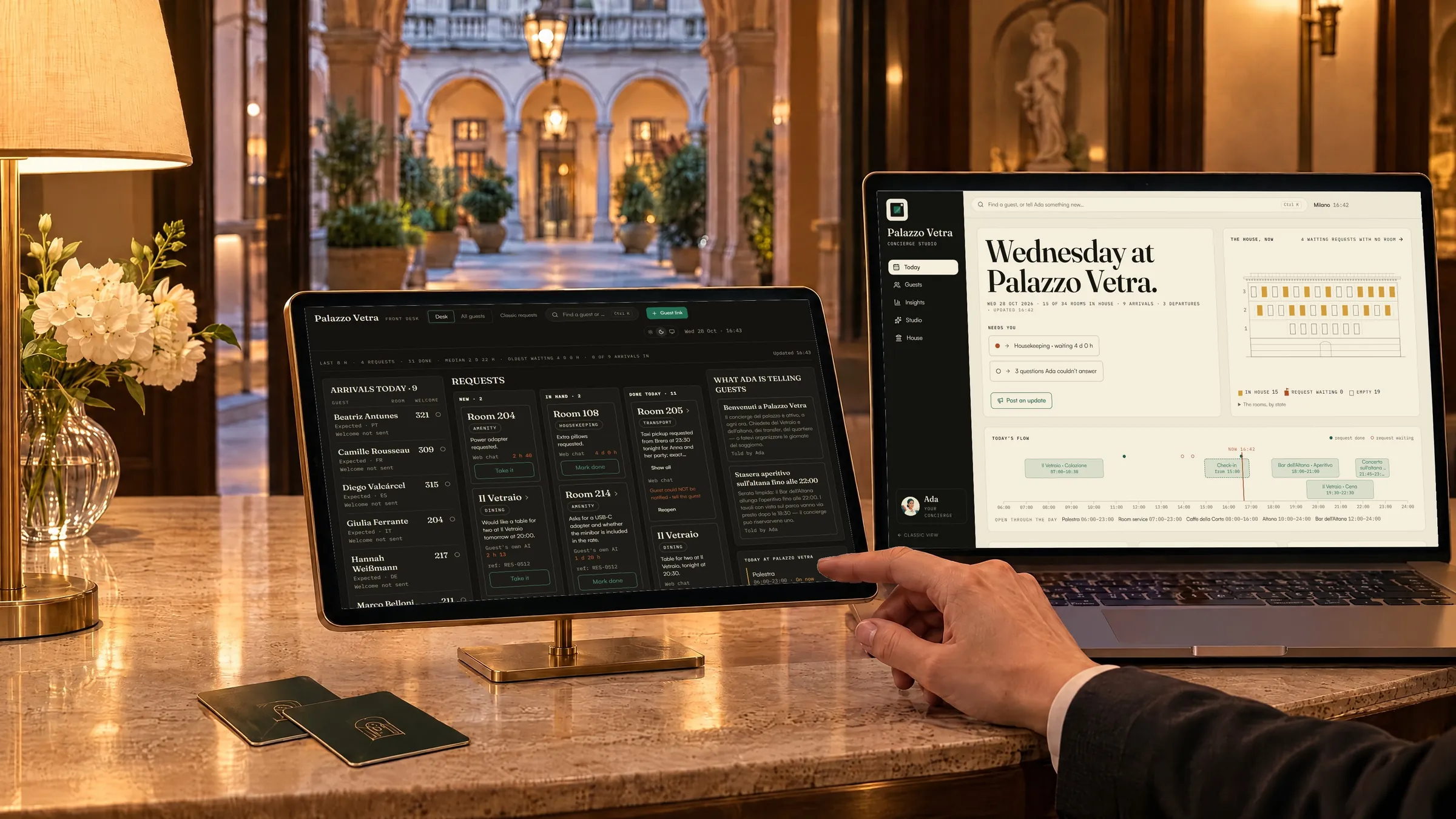 A hotel front desk at dusk. A tablet on the counter shows the front desk’s request board and a laptop shows Today: real Aikebom screens from Palazzo Vetra, our demo property.