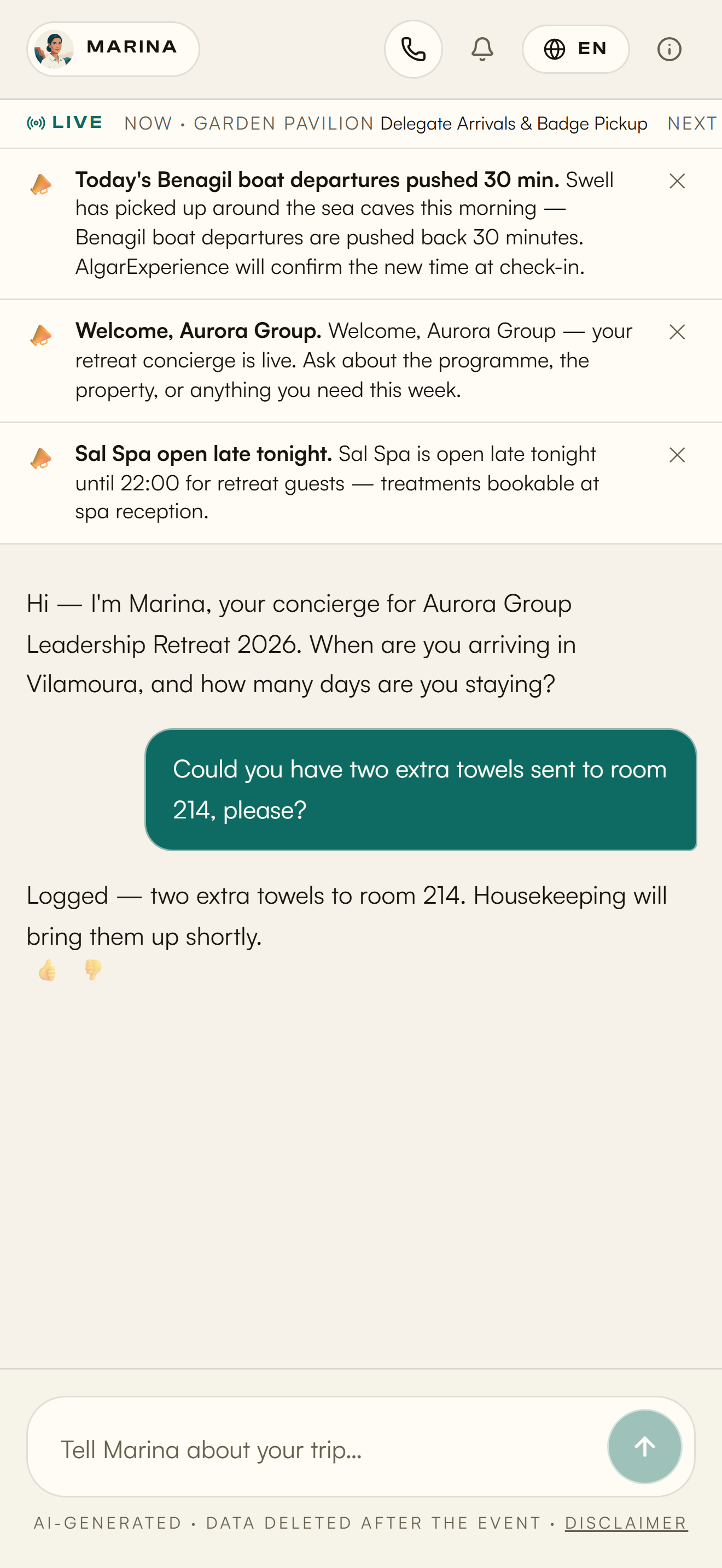 A guest asks for towels to room 214 and the concierge confirms it's logged for housekeeping — in the property's own light theme