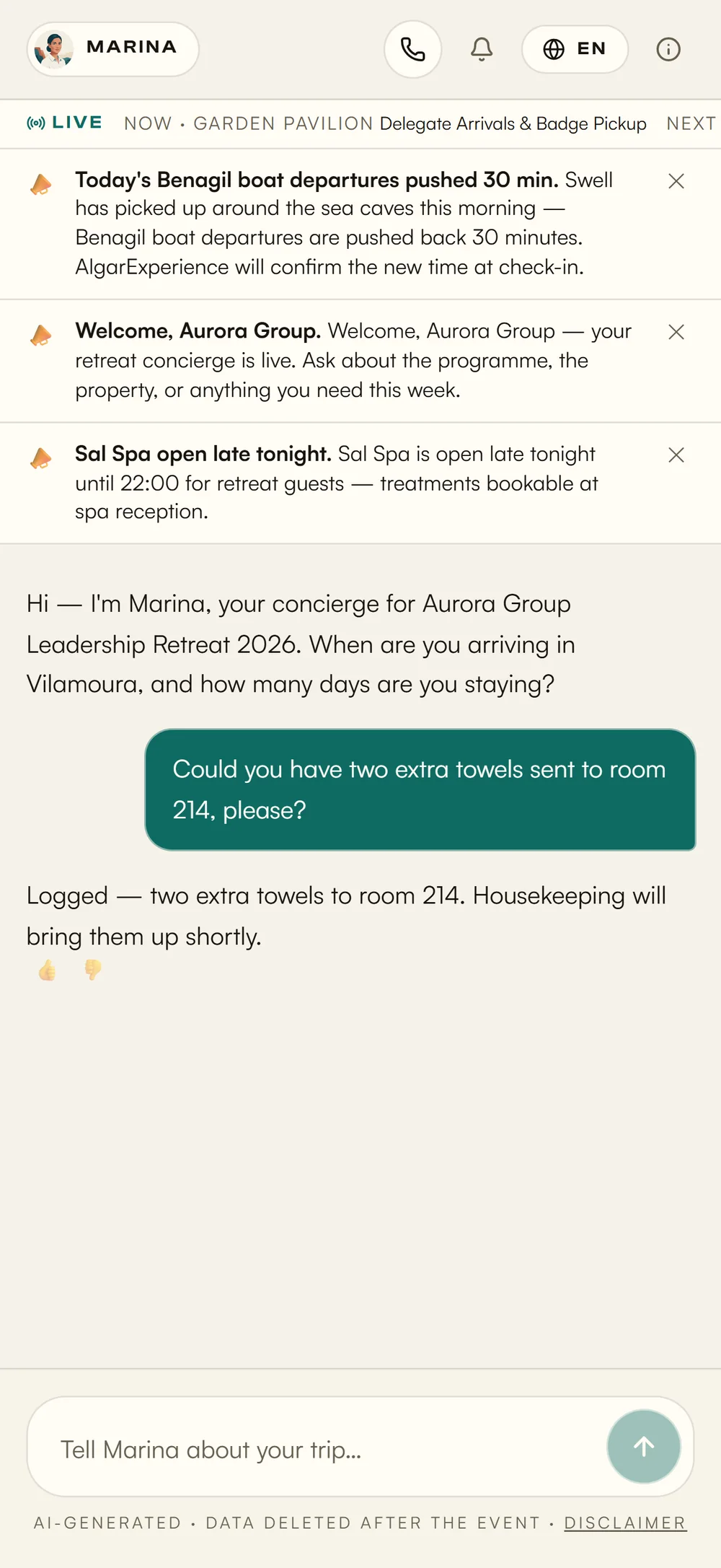 A guest asks for towels to room 214 and the concierge confirms it's logged for housekeeping — in the property's own light theme
